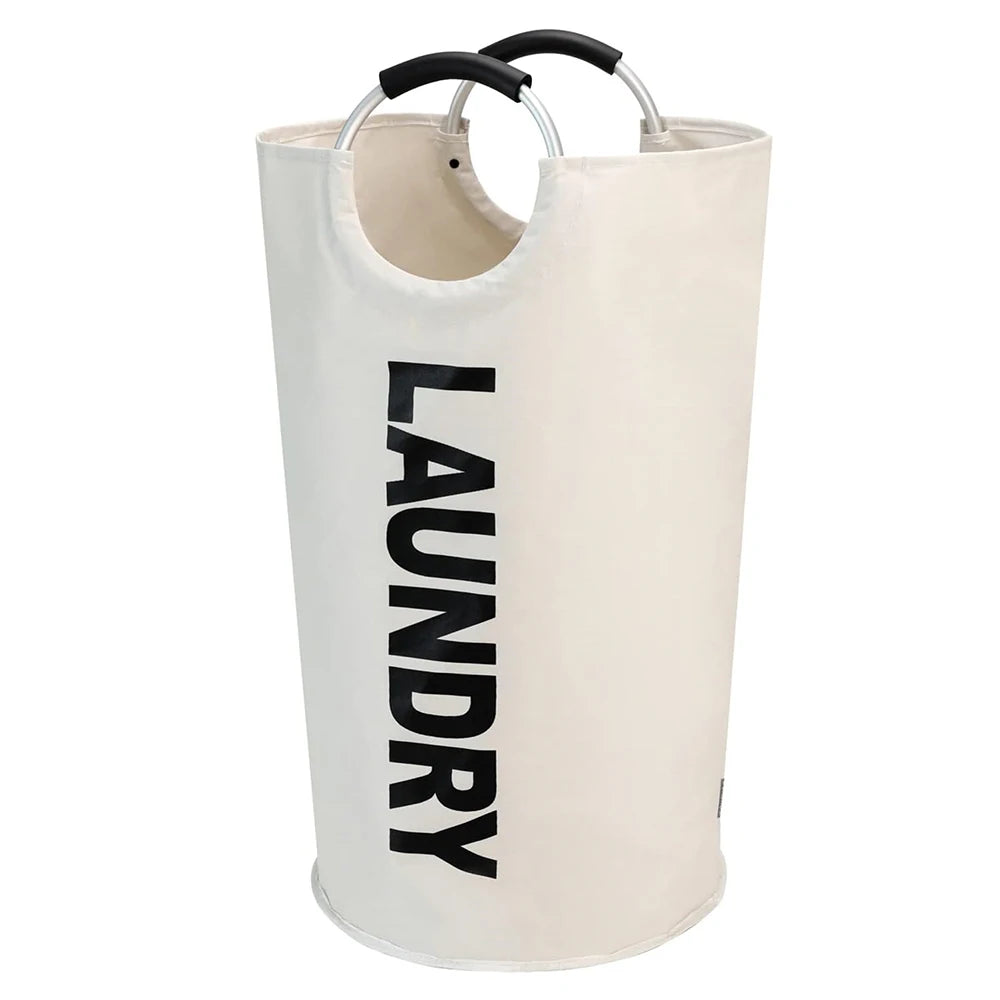 A tall, collapsible, waterproof laundry basket with a light beige or off-white fabric and black handles.