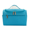 A teal waterproof hanging makeup bag with a clear lid and gold zippers.