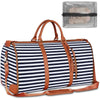 A striped navy and white duffel bag with brown leather straps and an attached clear plastic shoe pouch.