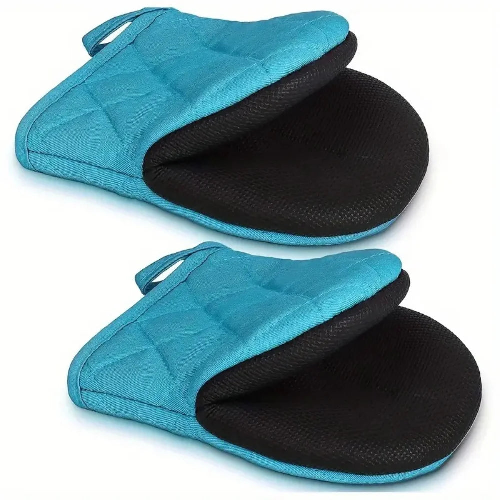 A pair of teal silicone oven mitts with black non-slip grips shown in a folded position.