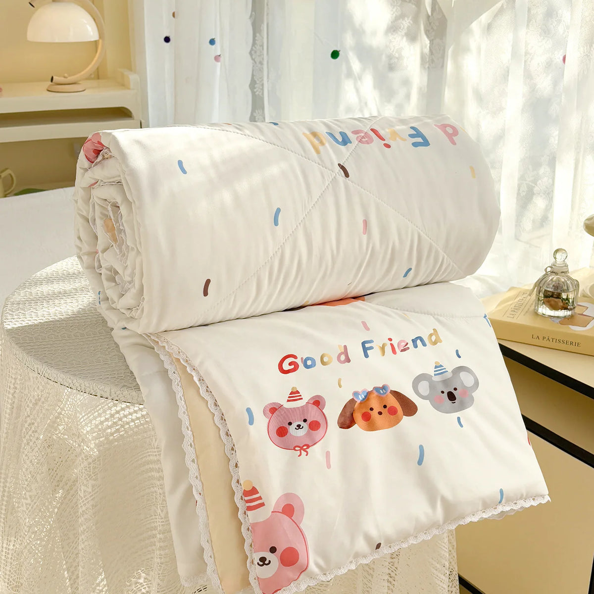 White comforter with a panda print featuring the text Good Friend and cute animal faces