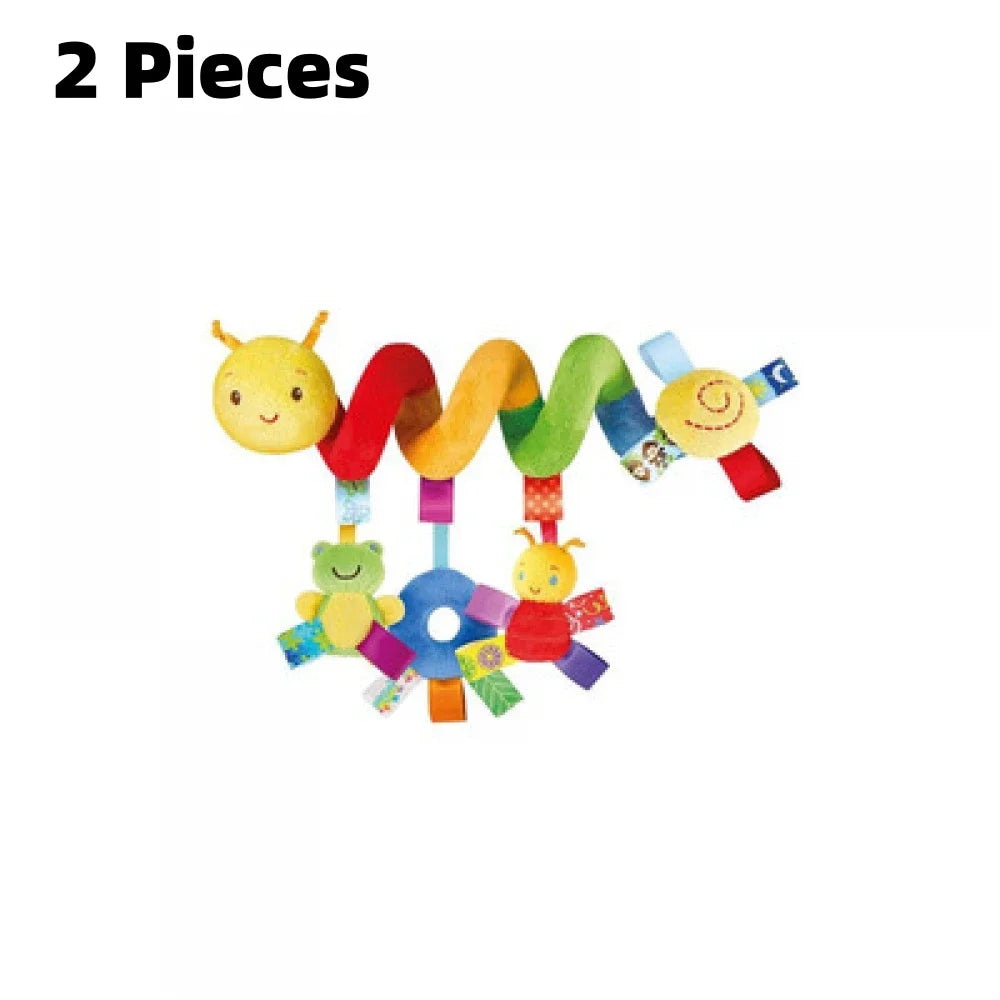 A set of two soft plush hanging baby toys featuring yellow and multicolored fabric shapes.