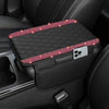 A black diamond quilted car armrest cover with a storage compartment and pink glitter accents.