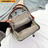 A vintage brown PU leather crossbody handbag is shown open, featuring a patterned fabric lining and metal hardware.