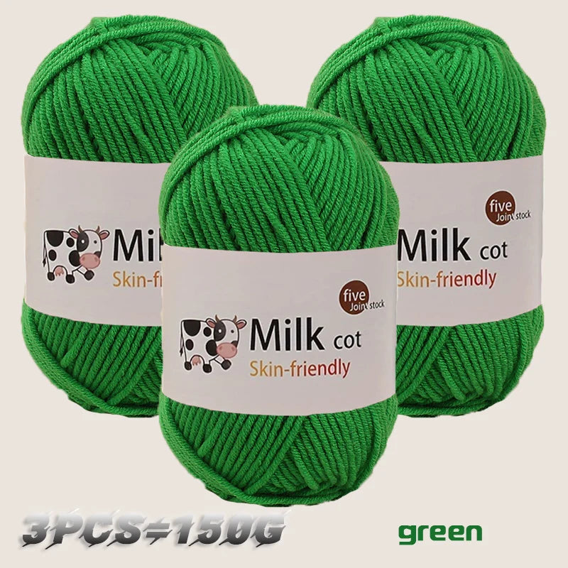 Three skeins of green silk-friendly milk cotton yarn for knitting and crochet projects