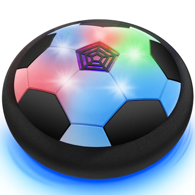 A black soccer ball is floating above a dark surface, illuminated with vibrant neon colors.