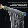 A hand is squeezing a grey double-wing internal shrinkage mop thoroughly and wringing it out.