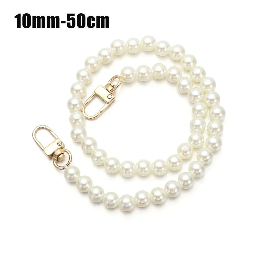 A delicate strand of white pearls used as a chain strap for bags or DIY purses.