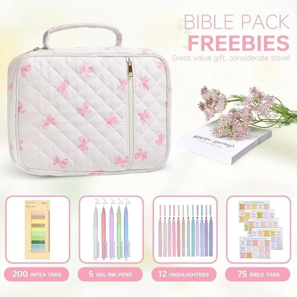 A pink floral quilted Bible cover with a zipper pocket and carry handle, shown next to various stationery items.