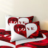 A close-up of a red rose floral duvet cover set featuring heart designs and deep red roses.