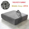 A gray velvet fabric sofa cover displayed on a floor, showing the texture and drape of the material.