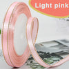 Roll of light pink gold-edge satin ribbon for crafts and gift wrapping