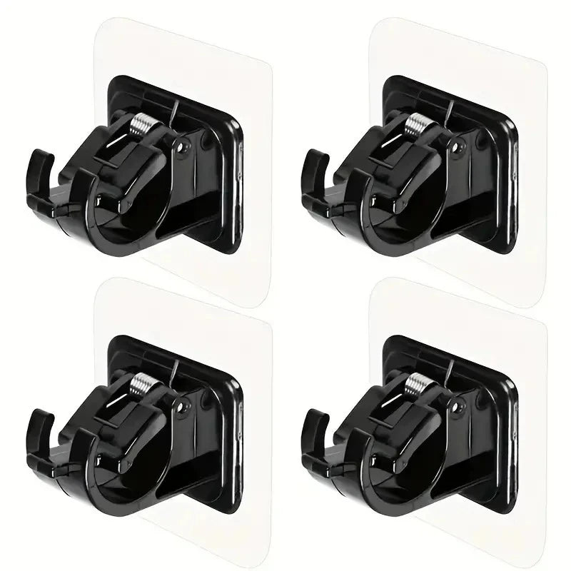 A set of two black self-adhesive no-drill curtain rod brackets for mounting curtains.