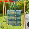 Folding hanging drying net with mesh protection in teal color displayed on a wooden frame.