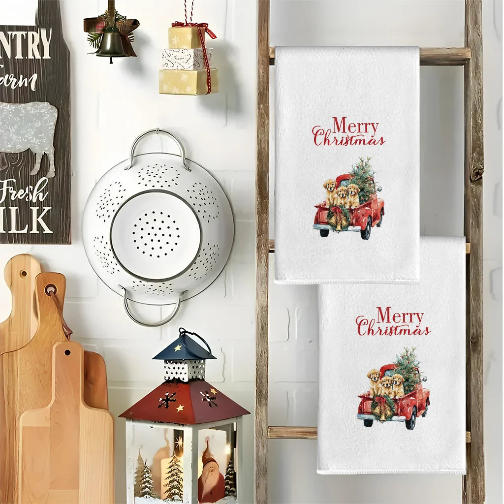 A set of Christmas themed kitchen towels featuring a red pickup truck loaded with gifts and greenery.