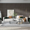 A modern living room featuring a light sofa, decorative pillows, and a dark wood-paneled accent wall.