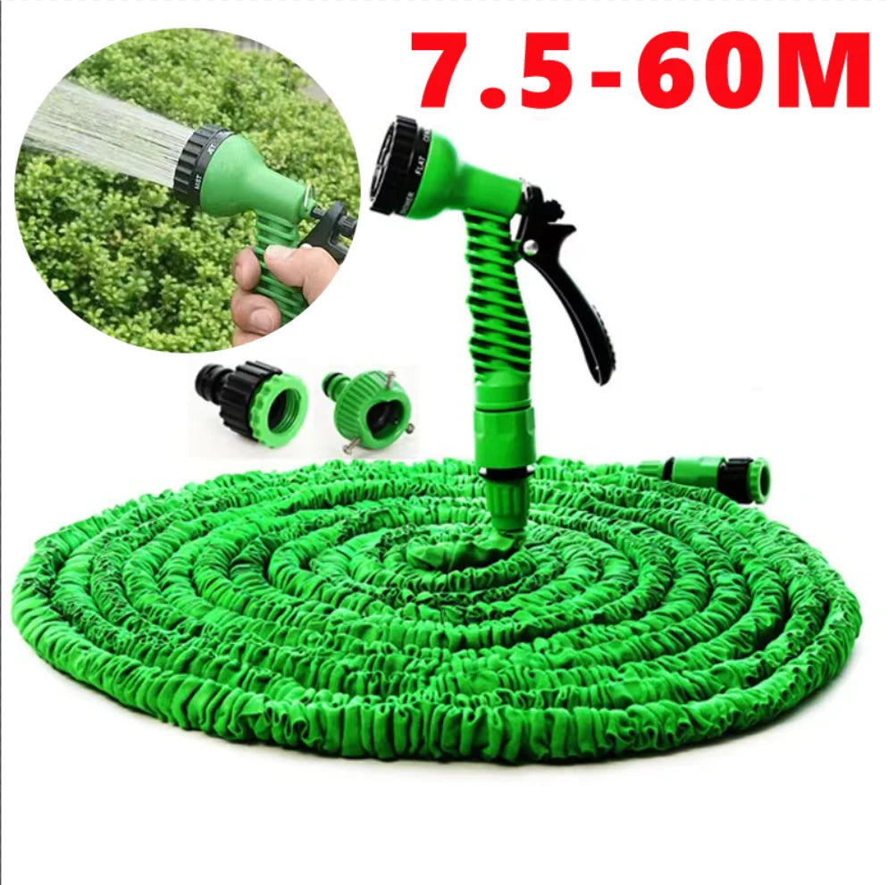 Green expandable magic hose with 7 spray patterns and a green nozzle spraying water onto a green mat.