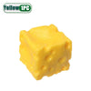 A yellow squishy stress relief toy shaped like a cube with dimples.