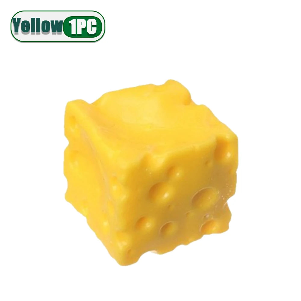 A yellow squishy stress relief toy shaped like a cube with dimples.