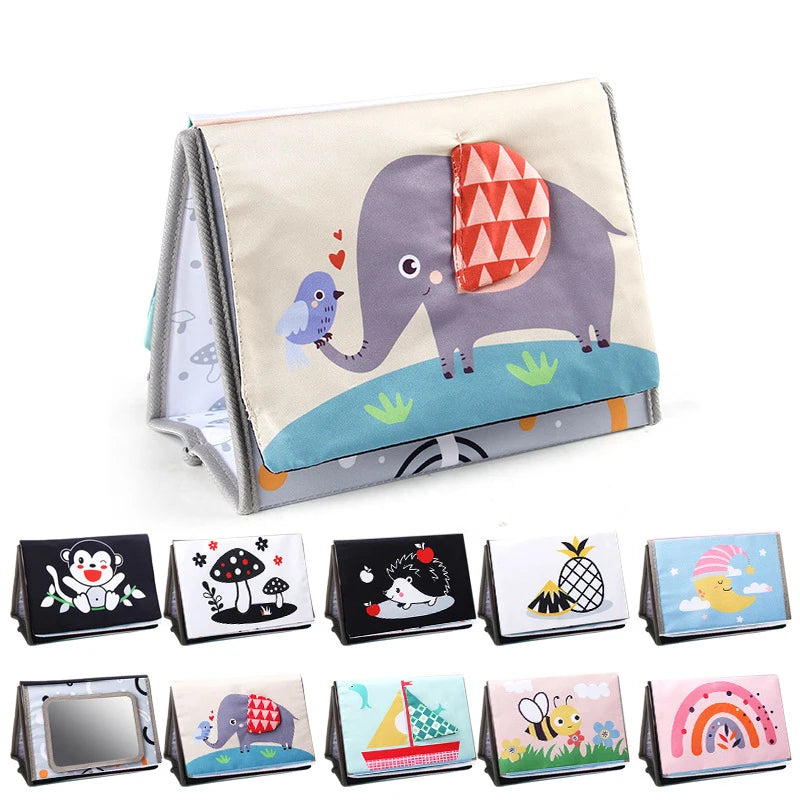 A high-contrast crinkle cloth book with a elephant design and a tummy time mirror for babies.