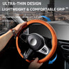 An orange steering wheel cover is shown being snapped onto a black steering wheel, highlighting its anti-slip grip feature.