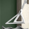 A white silicone squeegee broom is shown against a dark background, demonstrating its use for cleaning floors and windows.