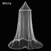 White elegant lace canopy mosquito net draped over a surface.