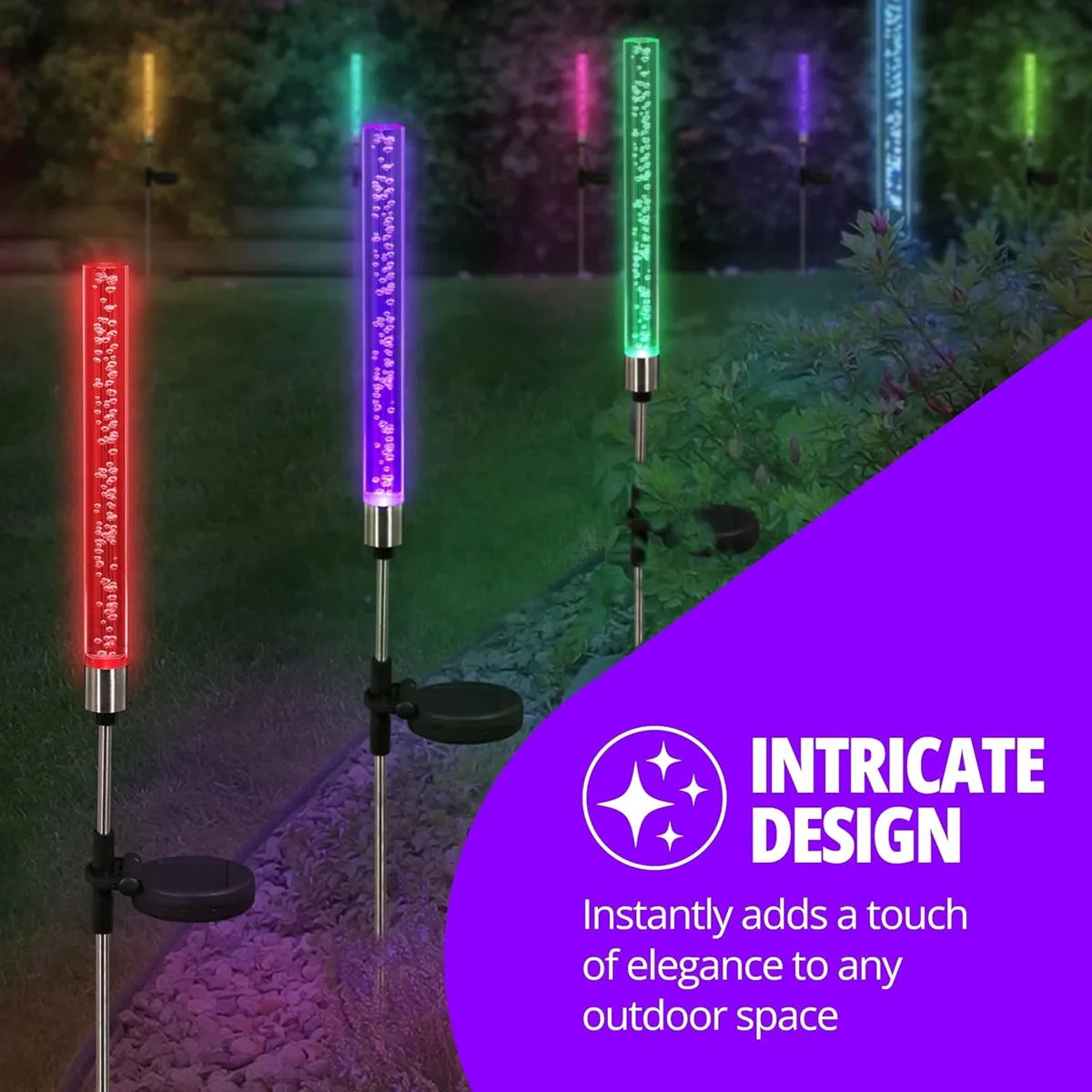 Vertical LED path lights with vibrant colors illuminating an outdoor garden space.