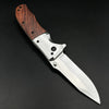 A folding pocket knife featuring a walnut wood handle and a stainless steel blade, shown in profile.