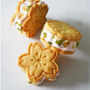A set of floral cookie cutters featuring cherry blossom, peach blossom, and sunflower designs.