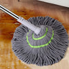 A gray self-wringing spin mop with a rotating head is shown on a wooden floor.
