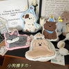 A collection of cartoon dog-themed hanging hand towels and accessories featuring various breeds and colors.
