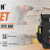 A black tool tote bag with numerous pockets and tools is displayed on a wooden surface.