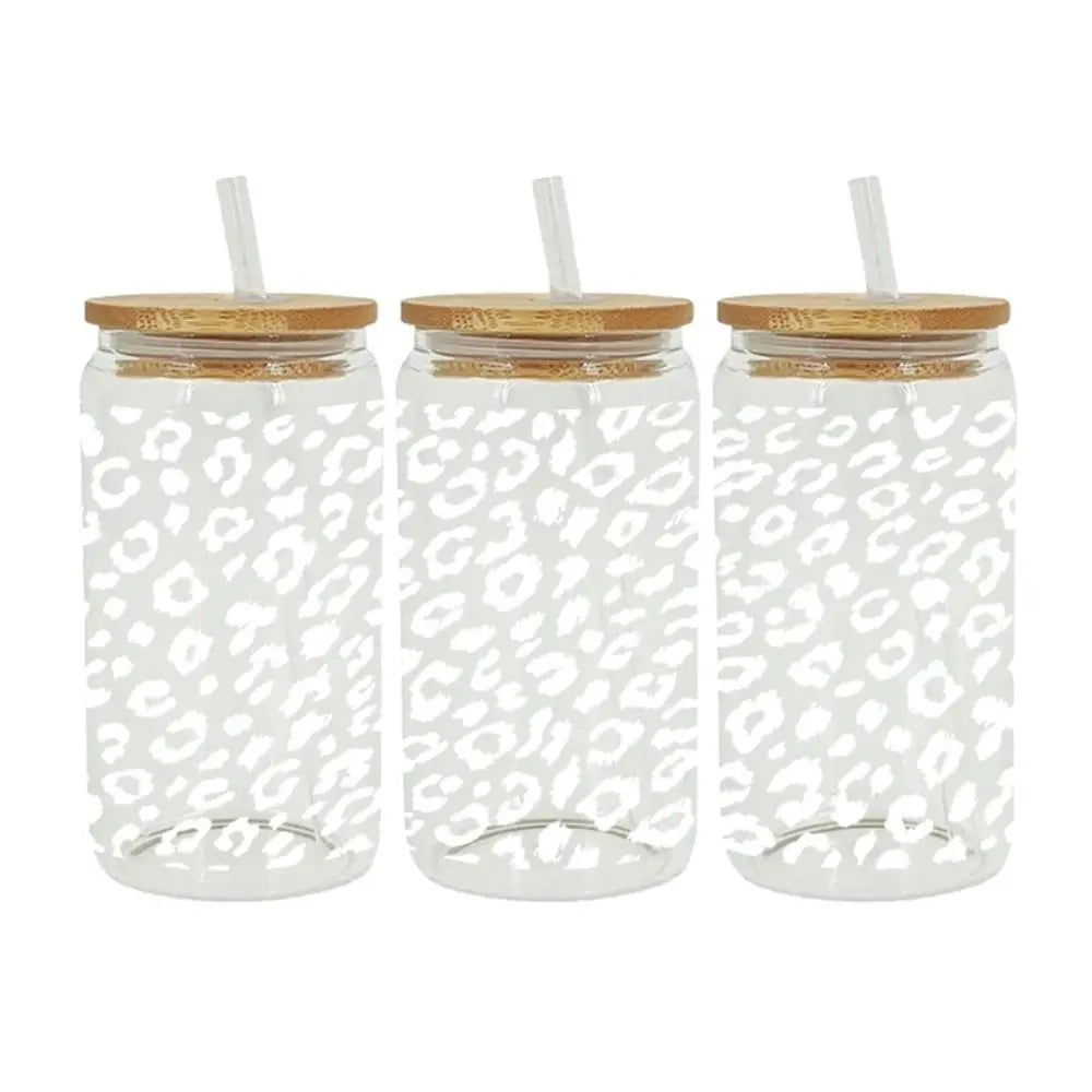 Clear glass cup wrapped with a leopard print UV DTF sticker and a wooden lid.