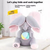 A gray elephant plush toy with pink ears is shown on a white surface.