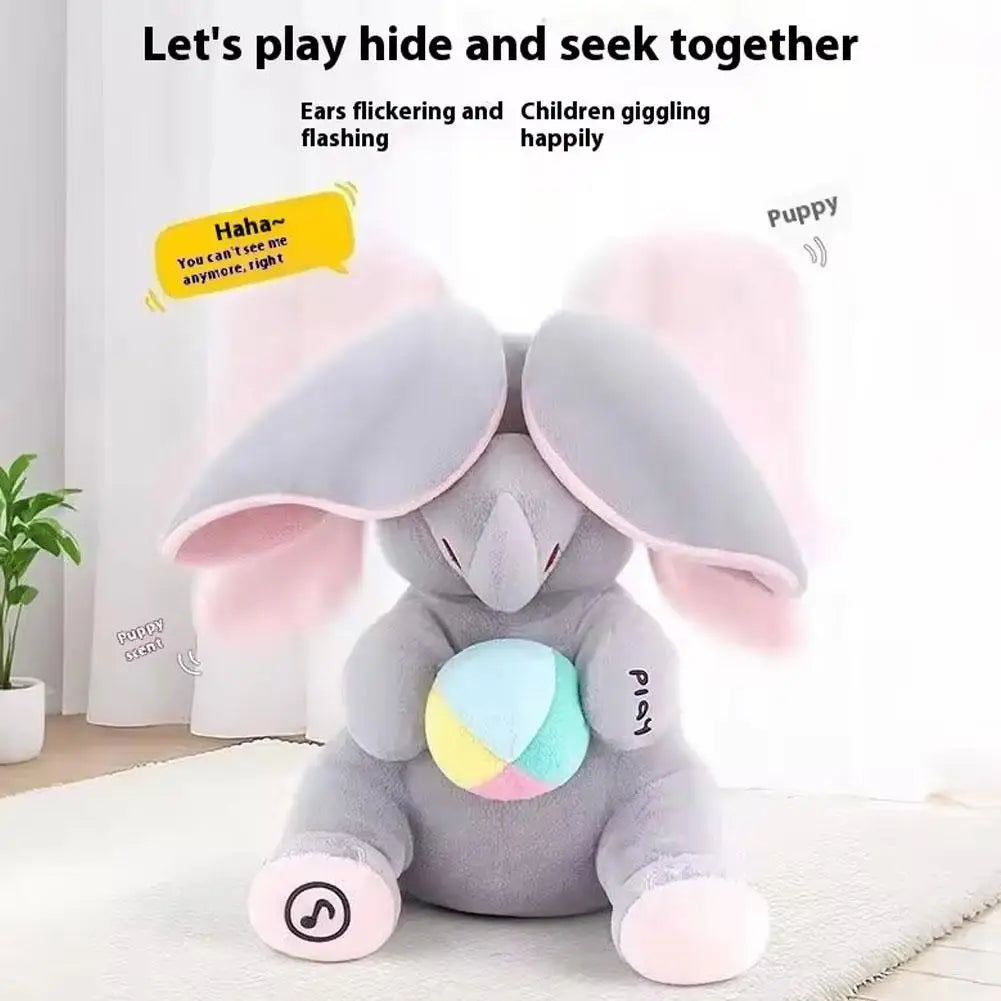A gray elephant plush toy with pink ears is shown on a white surface.