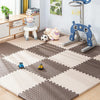 An interlocking foam play mat featuring a checkered pattern with various animal toys like a lion and a sheep.