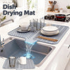 A silicone dish drying mat is shown draining water into a kitchen sink, demonstrating its function.