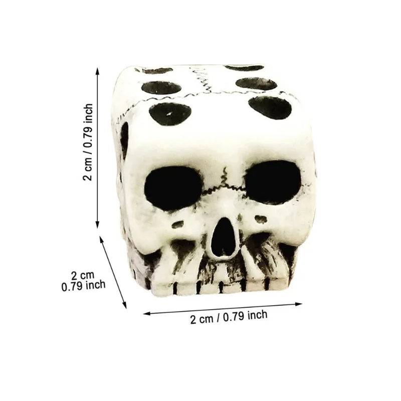 A white gothic skull dice set with markings, shown from the top and side.