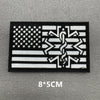 Black embroidered patch featuring a white American flag design with a stylized snake motif.