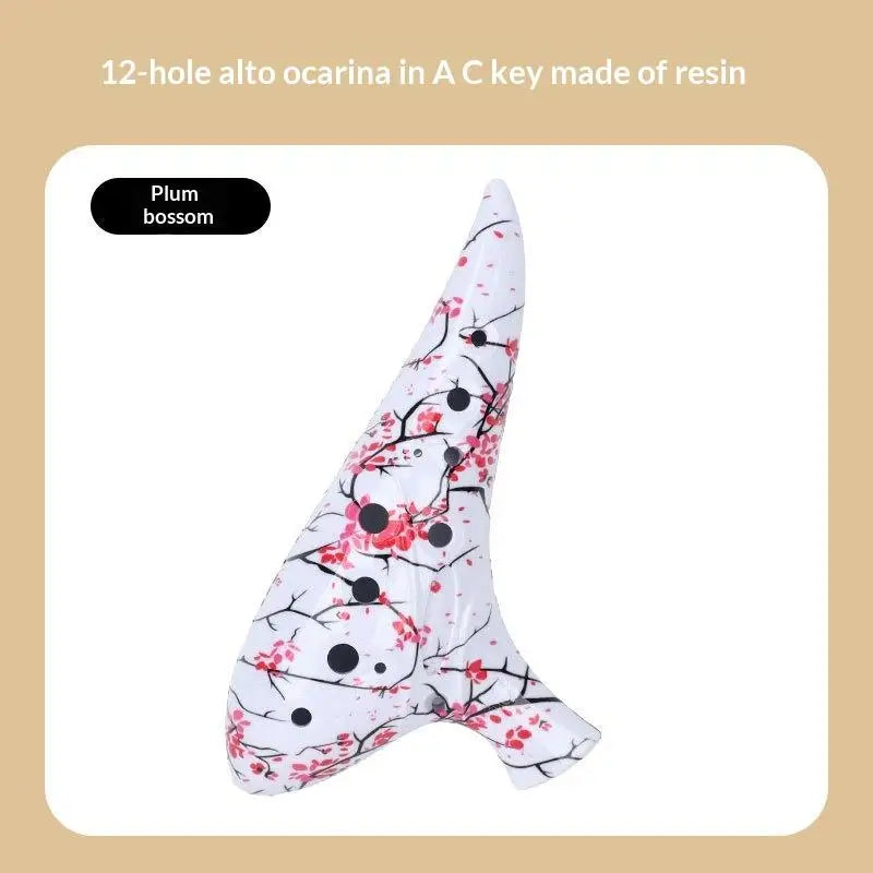 A white ocarina in the shape of a plum blossom flower with black accents.