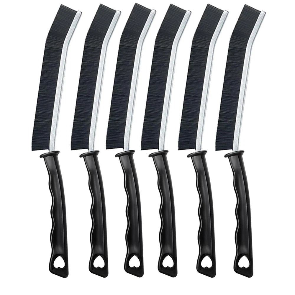 A set of black and white multifunctional crevice cleaning brushes.