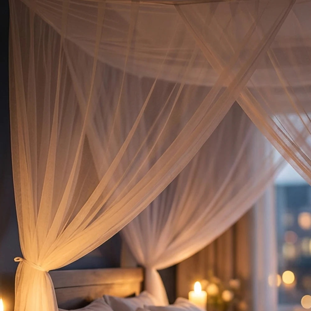 Elegant four-door mosquito net bed canopy draped in sheer white fabric indoors