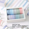 A box of 20 rolls of solid color tape in various pastel shades for journaling and crafts