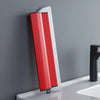 A red and white professional skimming blade with a stainless steel edge resting on a white countertop.