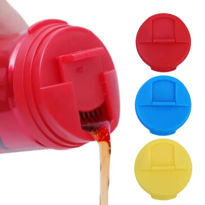 A red bottle is being filled with liquid, and three colored reusable leakproof can covers are shown next to it.