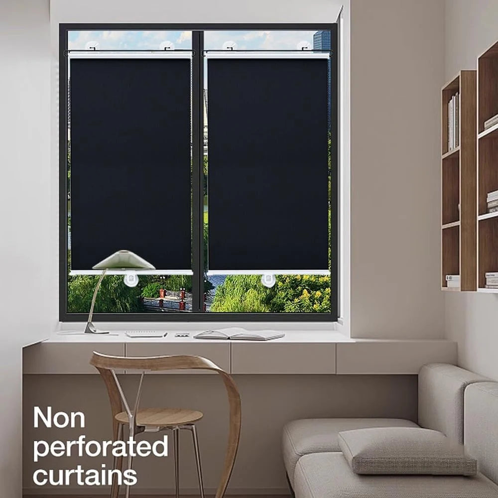 A window fitted with black cordless retractable roller shades in a modern interior setting.