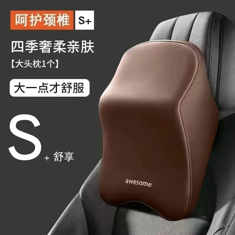 A brown memory foam car headrest and lumbar support pillow placed in a gray car seat.