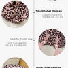 Pink leopard print nylon backpack showing various features like a smooth zipper, small label display, adjustable shoulder str