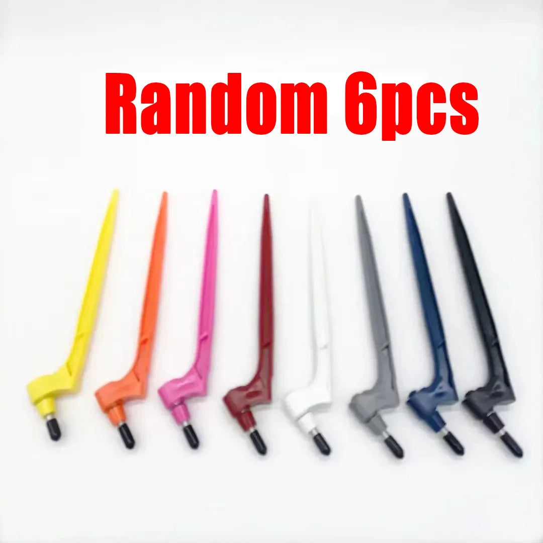 Six replacement blades of various colors laid out on a white background.